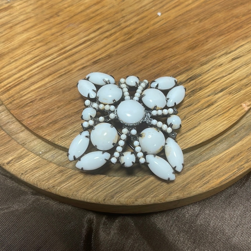 White stone brooch